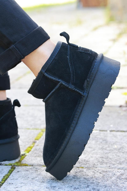 Bottes noires basses en cuir fourrées à plateforme — 1