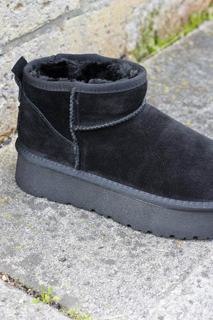 Bottes noires basses en cuir fourrées à plateforme — 4